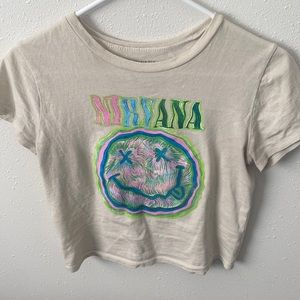 Cream colored crop top from Nirvana in a size small